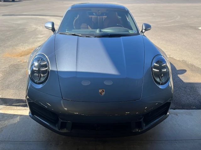 Front view of a Porsche 911 Turbo, showing the low nose and bumper that take the most stone damage