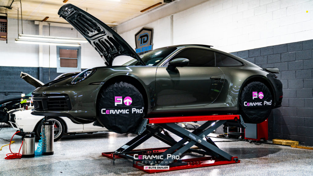 Porsche on lift for Paint Protection Film at Ceramic Pro Pottsown