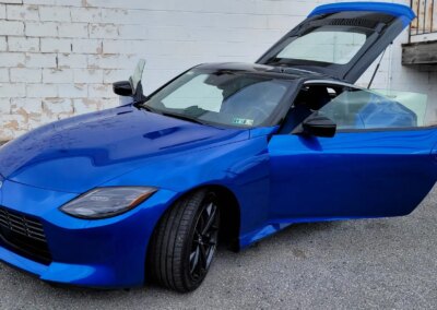 A clean and shiny black car after detailing service.