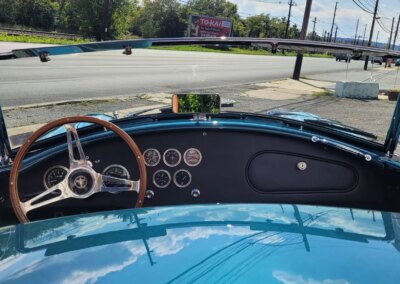 A clean and shiny black car after detailing service.