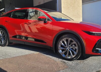 A car being detailed by a professional at Total Detailing Auto Spa.