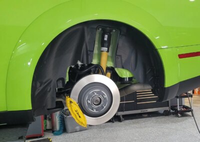 A clean and shiny black car after detailing service.