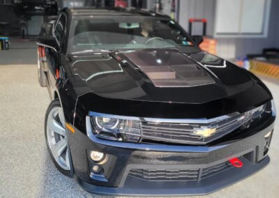 A car being detailed and polished at Total Detailing Auto Spa.